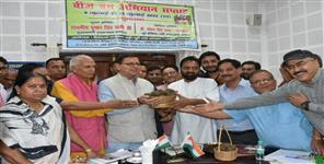 Uttar Pradesh News: CM Dhami launches Seed Bomb Campaign Week